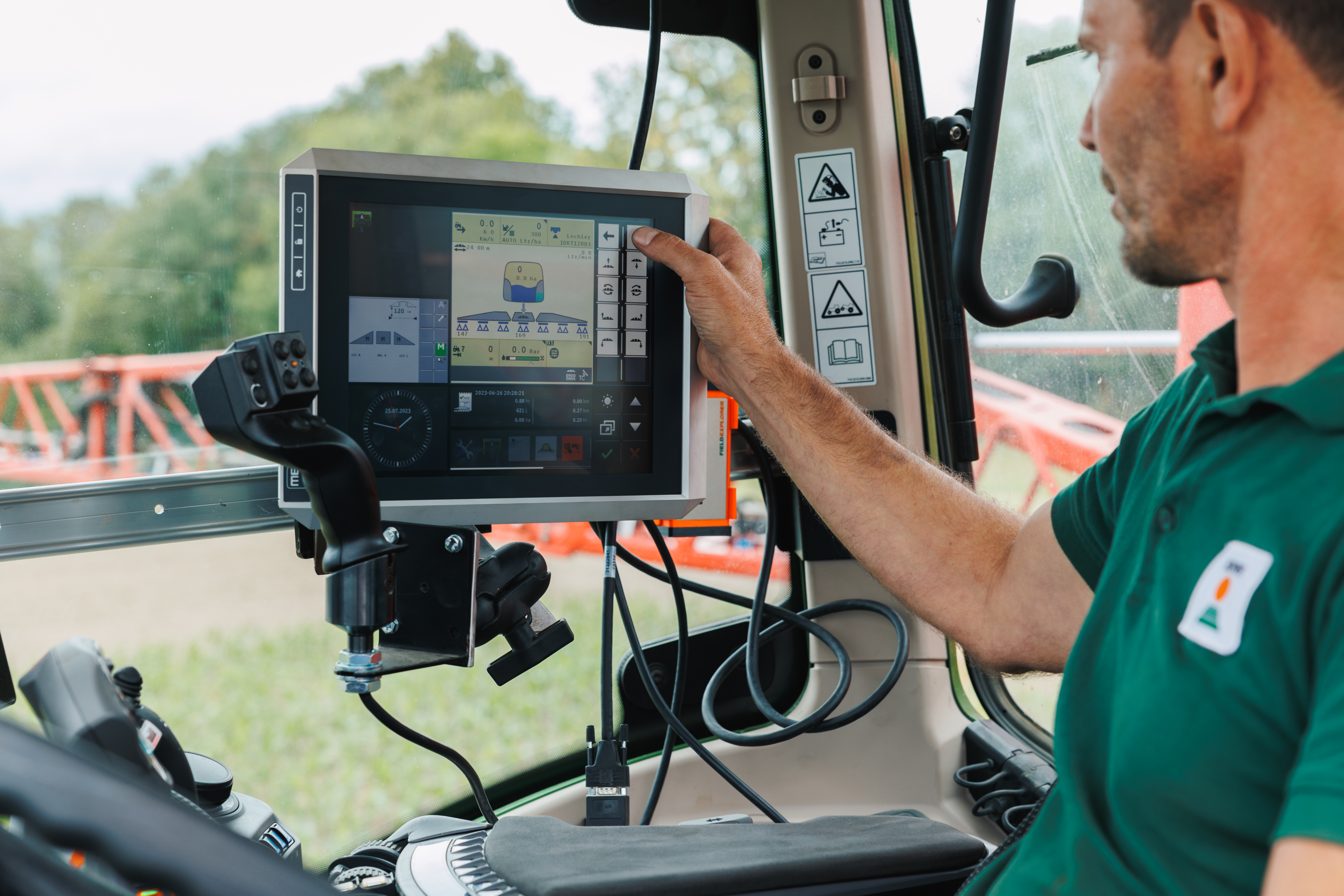 Digital solutions on a big screen in a tractor on the field